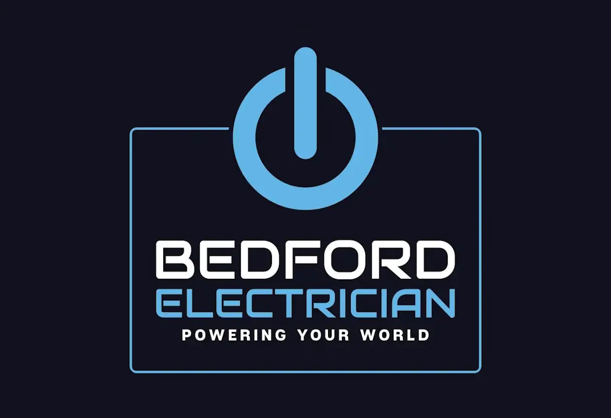 Logo featuring a blue power button icon above the words "Bedford Electrician" in white and light blue letters. The phrase "Powering Your World" is written below in smaller white text, all set against a dark background.