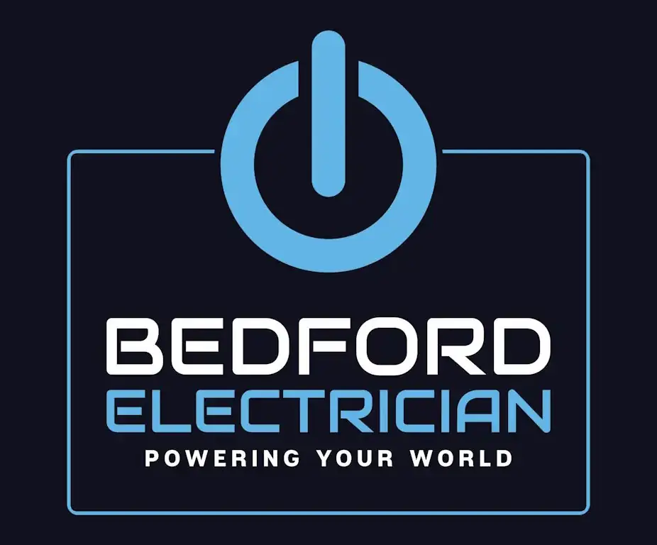 Logo for Bedford Electrician on a dark background. Features a blue power button symbol above the text "BEDFORD ELECTRICIAN" in white, with the tagline "POWERING YOUR WORLD" in blue underneath.